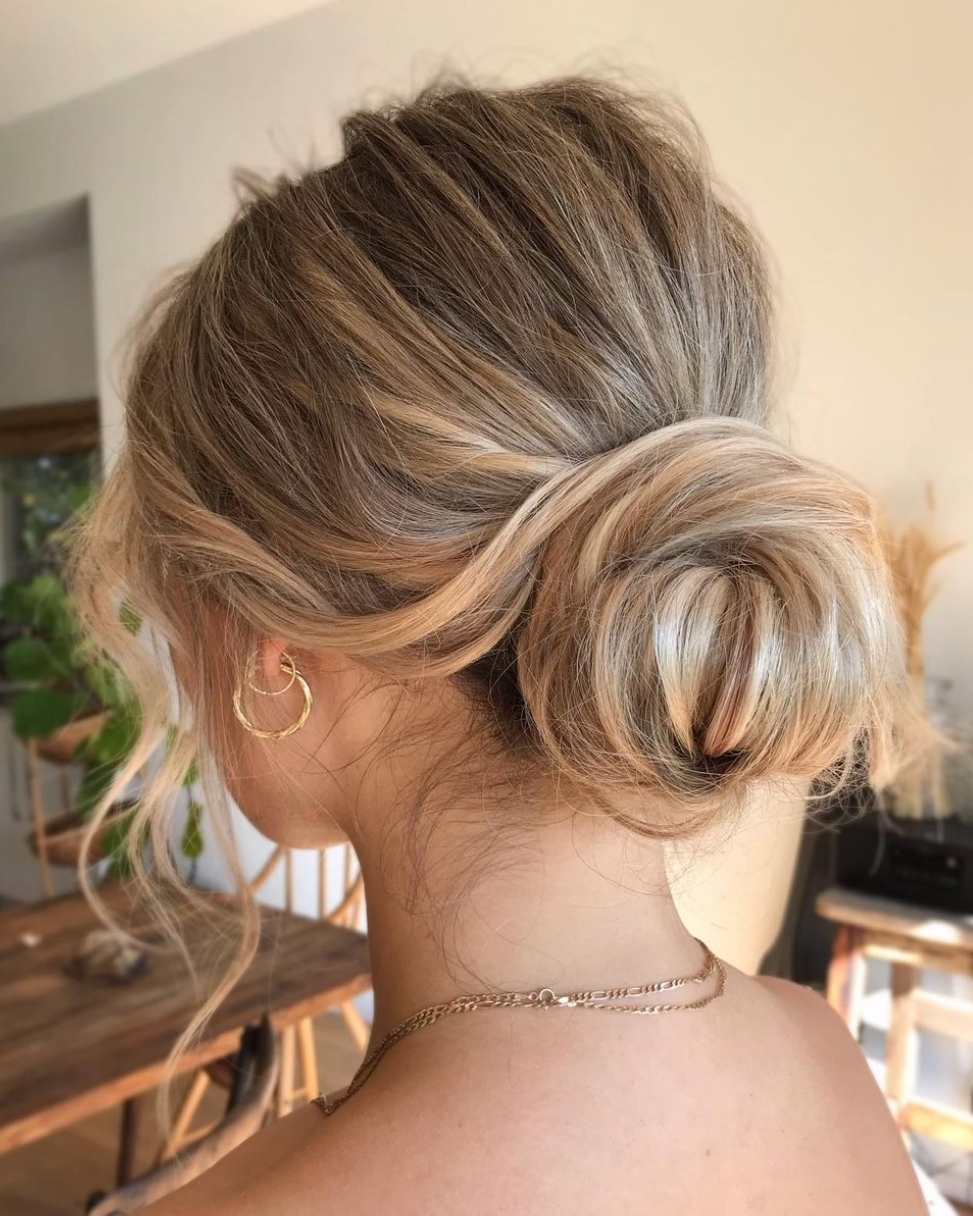 Low Messy Bun with Tendrils